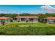 Building showcasing rear view and landscape at 1812 Mariner Dr # 137, Tarpon Springs, FL 34689