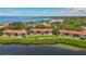 Aerial perspective of condo community near water, emphasizing building location and surroundings at 1812 Mariner Dr # 137, Tarpon Springs, FL 34689