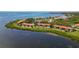 Aerial view highlighting condo building location near waterfront, with lush greenery at 1812 Mariner Dr # 137, Tarpon Springs, FL 34689