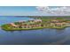 Wide aerial view of waterfront condo community, showing building placement and water access at 1812 Mariner Dr # 137, Tarpon Springs, FL 34689