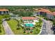 Community pool, tennis courts, and clubhouse at 1812 Mariner Dr # 137, Tarpon Springs, FL 34689