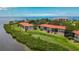 Aerial view of waterfront condo community, showcasing building location and surrounding landscape at 1812 Mariner Dr # 137, Tarpon Springs, FL 34689