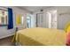 Bedroom with yellow walls and a nightstand at 1812 Mariner Dr # 137, Tarpon Springs, FL 34689