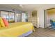 Bright bedroom with water views and a dresser at 1812 Mariner Dr # 137, Tarpon Springs, FL 34689