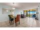 Bright dining area with water view from window at 1812 Mariner Dr # 137, Tarpon Springs, FL 34689