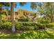 Building exterior showcasing landscaping and entrance at 1812 Mariner Dr # 137, Tarpon Springs, FL 34689