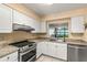 Kitchen with stainless steel appliances and water views at 1812 Mariner Dr # 137, Tarpon Springs, FL 34689