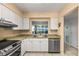 Kitchen with stainless steel appliances and water views at 1812 Mariner Dr # 137, Tarpon Springs, FL 34689