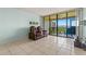 Living room with water view from sliding doors at 1812 Mariner Dr # 137, Tarpon Springs, FL 34689