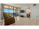 Living room with balcony access and water view at 1812 Mariner Dr # 137, Tarpon Springs, FL 34689