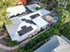 Aerial view showing home, solar panels, and pool at 1926 Burlington N Ave, St Petersburg, FL 33713