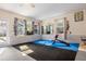 Finished basement with exercise equipment and mirrors at 1926 Burlington N Ave, St Petersburg, FL 33713