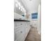 Clean bathroom with white cabinets and dark countertop at 1926 Burlington N Ave, St Petersburg, FL 33713