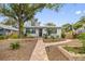 Charming bungalow with landscaped front yard and walkway at 1926 Burlington N Ave, St Petersburg, FL 33713