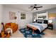 King-size bedroom with wood-like flooring and blue accents at 1939 Sandra Dr, Clearwater, FL 33764