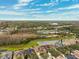 Aerial view of community with pond and preserve at 20716 Amanda Oak Ct, Land O Lakes, FL 34638