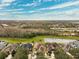 Aerial view of community with pond and preserve at 20716 Amanda Oak Ct, Land O Lakes, FL 34638