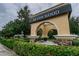 Devon Wood community entrance with water feature and landscaping at 20716 Amanda Oak Ct, Land O Lakes, FL 34638