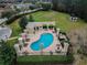 Kidney shaped community pool with surrounding lounge area at 20716 Amanda Oak Ct, Land O Lakes, FL 34638