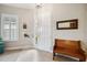 Bright entryway with a wooden bench, mirror, and window at 20716 Amanda Oak Ct, Land O Lakes, FL 34638