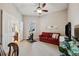Bright exercise room with a stationary bike, sofa, and TV at 20716 Amanda Oak Ct, Land O Lakes, FL 34638