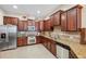 Modern kitchen with granite countertops and stainless steel appliances at 20716 Amanda Oak Ct, Land O Lakes, FL 34638