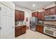 Modern kitchen with granite countertops and stainless steel appliances at 20716 Amanda Oak Ct, Land O Lakes, FL 34638