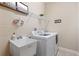 Laundry room with washer, dryer, and utility sink at 20716 Amanda Oak Ct, Land O Lakes, FL 34638