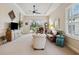 Spacious living room with sliding glass doors and neutral colors at 20716 Amanda Oak Ct, Land O Lakes, FL 34638