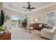 Spacious living room featuring a comfortable seating area and access to a patio at 20716 Amanda Oak Ct, Land O Lakes, FL 34638