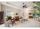Open living room with comfy seating and access to a patio at 20716 Amanda Oak Ct, Land O Lakes, FL 34638