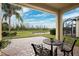 Relaxing patio with seating area overlooking pond at 20716 Amanda Oak Ct, Land O Lakes, FL 34638