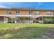 Backyard of the property, showing a grassy area and patios at 2292 Austrian Ln # 22, Clearwater, FL 33763