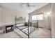 Bedroom with a metal framed bed and ceiling fan at 2292 Austrian Ln # 22, Clearwater, FL 33763