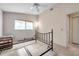 Simple bedroom with metal framed bed and ceiling fan at 2292 Austrian Ln # 22, Clearwater, FL 33763