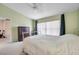 Spacious bedroom with a ceiling fan and large window at 2292 Austrian Ln # 22, Clearwater, FL 33763