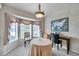 Charming dining area with bay window and decorative chandelier at 2292 Austrian Ln # 22, Clearwater, FL 33763