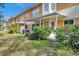 Back view of a building showing individual units, patios, and landscaping at 2292 Austrian Ln # 22, Clearwater, FL 33763