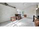 Spacious living room with a recliner, TV, and exercise bike at 2292 Austrian Ln # 22, Clearwater, FL 33763
