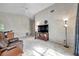 Bright living room featuring a large TV and comfortable seating at 2292 Austrian Ln # 22, Clearwater, FL 33763