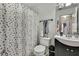 Bathroom with a shower/tub combo and a dark vanity at 30618 Birdhouse Dr, Wesley Chapel, FL 33545