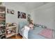 Bedroom with full bed, window with blinds, and plenty of stuffed animals at 30618 Birdhouse Dr, Wesley Chapel, FL 33545