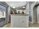 Kitchen with white cabinets and pantry at 30618 Birdhouse Dr, Wesley Chapel, FL 33545