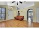 Bright living room with hardwood floors and an open concept layout at 30618 Birdhouse Dr, Wesley Chapel, FL 33545