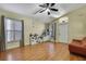Living room featuring hardwood floors and ample natural light at 30618 Birdhouse Dr, Wesley Chapel, FL 33545