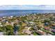 Aerial view of the house and surrounding waterfront community at 3908 Wahoo Se Dr, St Petersburg, FL 33705