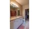 Bathroom with vanity, toilet, and walk-in closet access at 4221 W Spruce St # 1212, Tampa, FL 33607
