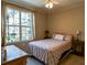 Bright bedroom with a queen bed, large window, and ample natural light at 4221 W Spruce St # 1212, Tampa, FL 33607