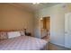 Bedroom with a queen bed, en-suite bathroom access, and neutral color scheme at 4221 W Spruce St # 1212, Tampa, FL 33607