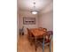 Simple dining area with wood table and chairs at 4221 W Spruce St # 1212, Tampa, FL 33607